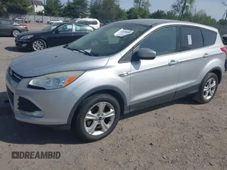 2015 Ford Escape SE with VIN 1FMCU9GX9FUC19545, listed as a IAAI auction lot 42128800 with 157,506 mi miles. Bid and sale history available at carsss.com. Image 2.