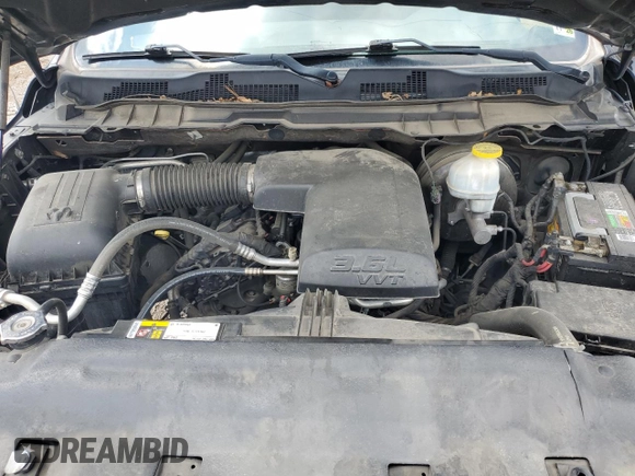 2018 Ram 1500 Tradesman z VIN 1C6RR6FG2JS336363, wystawiony jako Copart lot #58731665 z przebiegiem 133 398 mil mil oraz Szkoda całkowita • Salvage title. Historia ofert i sprzedaży dostępna na DreamBid. Obrazek 11.
