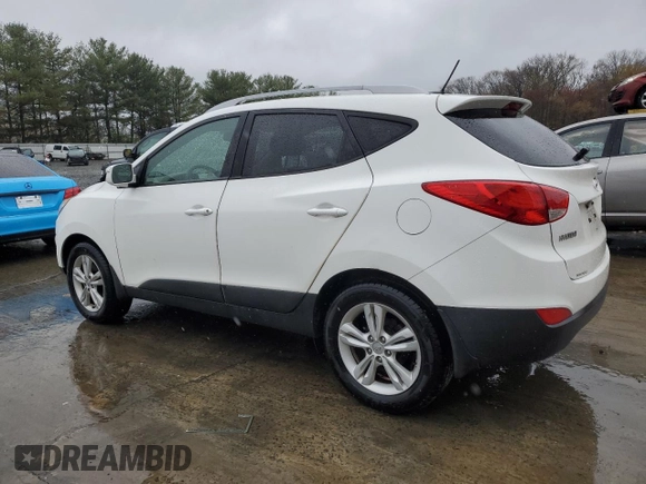 2013 Hyundai Tucson GLS with VIN KM8JU3AC0DU770079, listed as a Copart auction lot 52639835 with 212,894 mi miles and Clean Title. Bid and sale history available at carsss.com. Image 2.