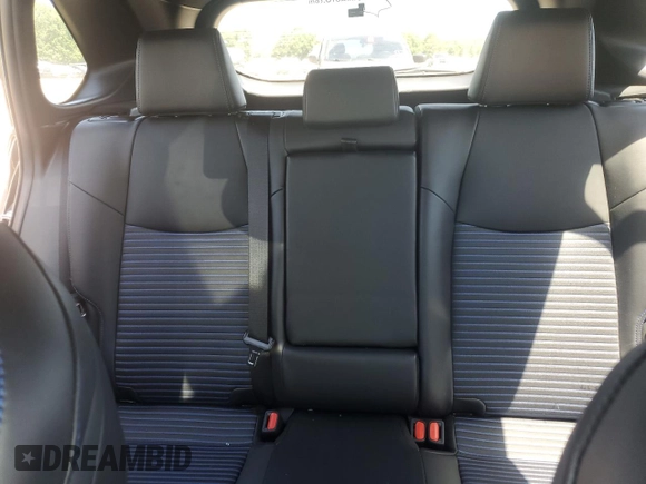 2023 Toyota RAV4 Hybrid XSE with VIN 2T3E6RFV9PW039963, listed as a Copart auction lot 57594335 with 27,486 mi miles and Salvage title. Bid and sale history available at DreamBid. Image 10.