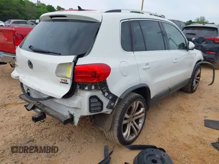 2016 Volkswagen Tiguan S with VIN WVGBV7AXXGW585445, listed as a IAAI auction lot 42083377 with 111,011 mi miles and . Bid and sale history available at DreamBid. Image 4.