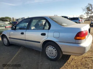 1997 Honda Civic DX with VIN 2HGEJ6623VH542972, listed as a Copart auction lot 84721694 with 257,296 mi miles and Salvage Title. Bid and sale history available at carsss.com. Image 2.