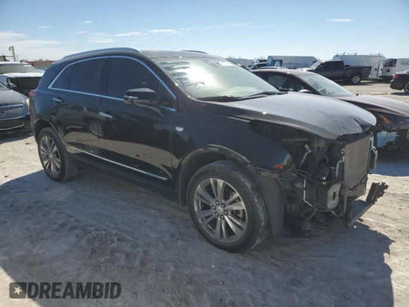 2023 Cadillac XT5 FWD Premium Luxury with VIN 1GYKNCRS5PZ109358, listed as a Copart auction lot 45201135 with 28,222 mi miles and Salvage Title. Bid and sale history available at carsss.com. Image 4.