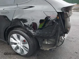 2022 Tesla Model Y Performance with VIN 7SAYGDEF7NF403701, listed as a IAAI auction lot 41961532 with 83,728 mi miles and . Bid and sale history available at DreamBid. Image 6.