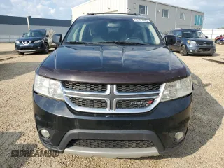 2015 Dodge Journey SXT with VIN 3C4PDCCG5FT559021, listed as a Copart auction lot 60101335 with 323,930 mi miles and Salvage title. Bid and sale history available at DreamBid. Image 5.