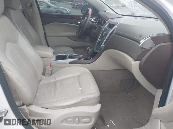 2011 Cadillac SRX Performance Collection with VIN 3GYFNBEY7BS585753, listed as a IAAI auction lot 42114525 with 233,329 mi miles and . Bid and sale history available at carsss.com. Image 5.