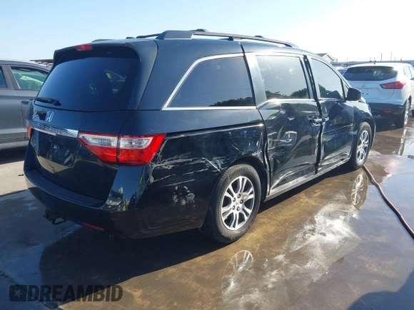 2013 Honda Odyssey EX-L with VIN 5FNRL5H6XDB090768, listed as a IAAI auction lot 42008759 with 116,052 mi miles and . Bid and sale history available at carsss.com. Image 4.