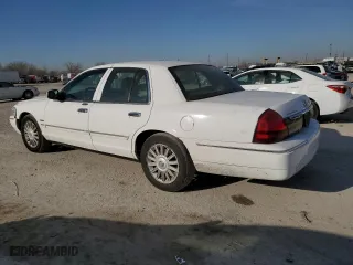 2010 Mercury Grand Marquis LS with VIN 2MEBM7FV7AX614134, listed as a Copart auction lot 48724825 with 129,960 mi miles and Salvage Title. Bid and sale history available at carsss.com. Image 2.