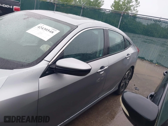 2016 Honda Civic EX-L z VIN 19XFC1F70GE003249, wystawiony jako IAAI lot #42430548 z przebiegiem 103 002 mil mil oraz . Historia ofert i sprzedaży dostępna na DreamBid. Obrazek 14.
