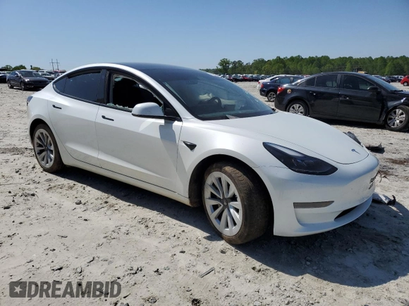 2023 Tesla Model 3 with VIN 5YJ3E1EA9PF558088, listed as a Copart auction lot 52228465 with 63,204 mi miles and Salvage title. Bid and sale history available at DreamBid. Image 4.