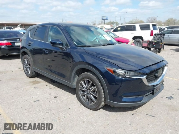2018 Mazda CX-5 Touring with VIN JM3KFACM3J1370129, listed as a IAAI auction lot 41829027 with 71,305 mi miles. Bid and sale history available at carsss.com. Image 1.