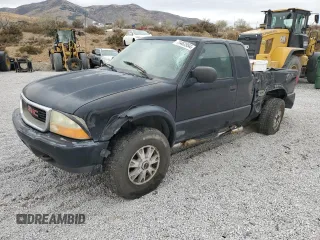 2003 GMC Sonoma SLS z VIN 1GTCT19X938283417, wystawiony jako Copart lot #78463954 z przebiegiem 215 039 mil mil oraz Szkody całkowita. Historia ofert i sprzedaży dostępna na DreamBid. Obrazek 1.
