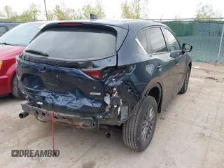 2017 Mazda CX-5 Touring with VIN JM3KFBCL2H0213740, listed as a IAAI auction lot 42165094 with 112,240 mi miles and . Bid and sale history available at DreamBid. Image 4.