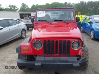 1999 Jeep Wrangler SE z VIN 1J4FY29P5XP487111, wystawiony jako IAAI lot #42125867 z przebiegiem 156 804 mil mil oraz . Historia ofert i sprzedaży dostępna na DreamBid. Obrazek 12.