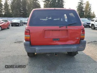 1996 Jeep Grand Cherokee z VIN 1J4EZ58Y5TC142263, wystawiony jako Copart lot #70532894 z przebiegiem Nie podano mil oraz Szkoda całkowita • Salvage title. Historia ofert i sprzedaży dostępna na DreamBid. Obrazek 6.