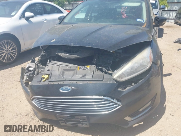 2015 Ford Focus Titanium with VIN 1FADP3J24FL385526, listed as a IAAI auction lot 42011712 with 162,696 mi miles and . Bid and sale history available at carsss.com. Image 6.