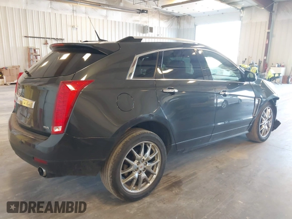 2014 Cadillac SRX Premium Collection z VIN 3GYFNGE38ES606731, wystawiony jako IAAI lot #41844450 z przebiegiem 156 541 mil mil oraz . Historia ofert i sprzedaży dostępna na DreamBid. Obrazek 4.