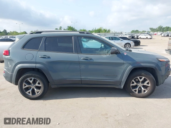 2014 Jeep Cherokee Trailhawk z VIN 1C4PJMBS2EW161276, wystawiony jako IAAI lot #42283358 z przebiegiem 135 201 mil mil oraz . Historia ofert i sprzedaży dostępna na DreamBid. Obrazek 13.