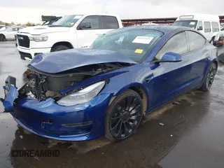 2022 Tesla Model 3 Performance with VIN 5YJ3E1EC7NF306192, listed as a IAAI auction lot 41453931 with 36,450 mi miles. Bid and sale history available at carsss.com. Image 18.