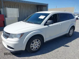 2014 Dodge Journey SE with VIN 3C4PDCAB4ET193896, listed as a IAAI auction lot 42126565 with 242,108 mi miles and . Bid and sale history available at carsss.com. Image 2.