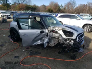 2016 MINI Countryman S with VIN WMWZC5C55GWU22112, listed as a Copart auction lot 82132654 with 60,210 mi miles and Salvage Title. Bid and sale history available at DreamBid. Image 4.