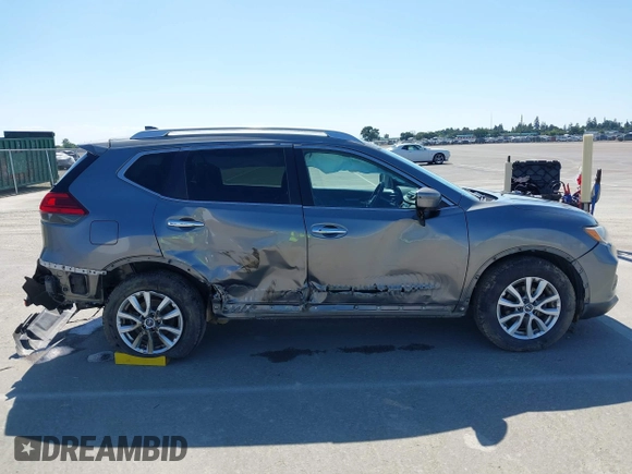 2017 Nissan Rogue SV with VIN KNMAT2MT9HP581822, listed as a IAAI auction lot 42140794 with 74,261 mi miles. Bid and sale history available at carsss.com. Image 13.