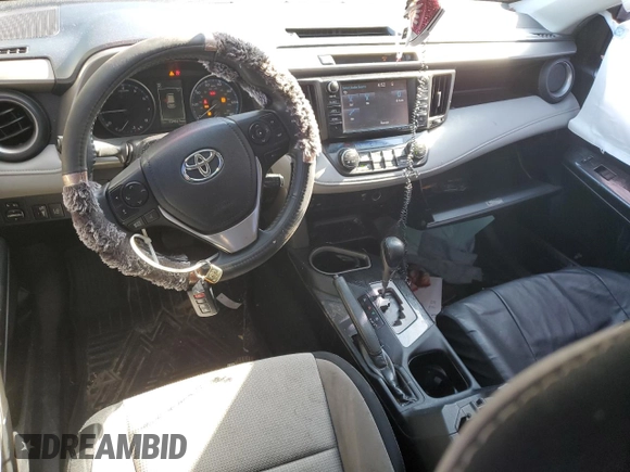 2018 Toyota RAV4 XLE with VIN 2T3RFREV5JW731373, listed as a Copart auction lot 51917465 with 124,623 mi miles and Salvage Title. Bid and sale history available at DreamBid. Image 8.