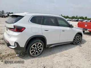 2023 BMW X1 xDrive28i with VIN WBX73EF06P5V77660, listed as a Copart auction lot 57342015 with 32,028 mi miles and Salvage title. Bid and sale history available at DreamBid. Image 3.
