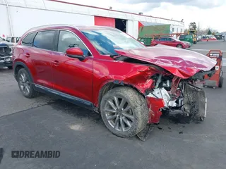 2020 Mazda CX-9 Grand Touring with VIN JM3TCBDY4L0423563, listed as a IAAI auction lot 41829394 with 76,704 mi miles and . Bid and sale history available at DreamBid. Image 1.