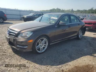2014 Mercedes-Benz C 250 Sport with VIN WDDGF4HB7EA944038, listed as a Copart auction lot 62121165 with 66,524 mi miles and Salvage title. Bid and sale history available at DreamBid. Image 1.