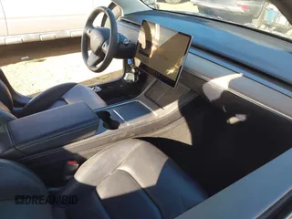 2022 Tesla Model 3 with VIN 5YJ3E1EA9NF295890, listed as a IAAI auction lot 41175917 with 42,230 mi miles and . Bid and sale history available at DreamBid. Image 5.