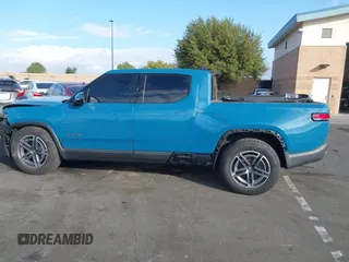 2025 Rivian R1T Adventure z VIN 7FCTGBAA9SN035986, wystawiony jako IAAI lot #41510257 z przebiegiem 2 102 mil mil oraz . Historia ofert i sprzedaży dostępna na DreamBid. Obrazek 15.