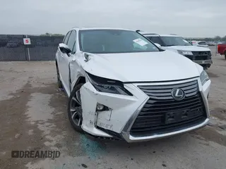 2018 Lexus RX 350L Premium z VIN JTJDZKCAXJ2010125, wystawiony jako IAAI lot #41899420 z przebiegiem 113 995 mil mil oraz . Historia ofert i sprzedaży dostępna na DreamBid. Obrazek 6.