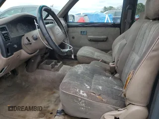 1999 Toyota Tacoma z VIN 4TAVL52N8XZ435689, wystawiony jako Copart lot #52162105 z przebiegiem 2 317 301 mil mil oraz Szkoda całkowita • Salvage title. Historia ofert i sprzedaży dostępna na DreamBid. Obrazek 7.