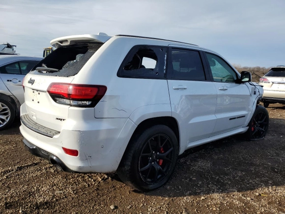2021 Jeep Grand Cherokee SRT with VIN 1C4RJFDJ0MC548983, listed as a Copart auction lot 84048824 with 45,247 mi miles and Salvage Title. Bid and sale history available at carsss.com. Image 3.