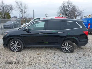 2017 Honda Pilot Touring with VIN 5FNYF6H90HB051700, listed as a IAAI auction lot 41902075 with 69,712 mi miles. Bid and sale history available at carsss.com. Image 15.