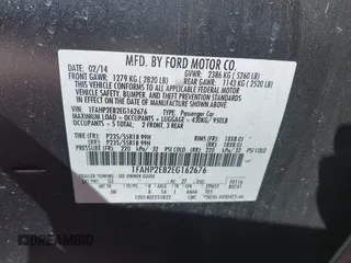 2014 Ford Taurus SEL with VIN 1FAHP2E82EG162676, listed as a IAAI auction lot 41795220 with 125,491 mi miles. Bid and sale history available at carsss.com. Image 9.