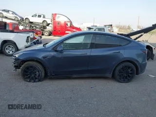 2023 Tesla Model Y Long Range with VIN 7SAYGDEE1PA053683, listed as a IAAI auction lot 42124517 with 32,295 mi miles. Bid and sale history available at carsss.com. Image 13.