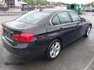 2018 BMW 3 Series 330i xDrive with VIN WBA8D9G50JNU69376, listed as a IAAI auction lot 41971138 with 61,551 mi miles. Bid and sale history available at carsss.com. Image 4.