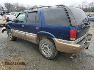 1999 GMC Jimmy SLE with VIN 1GKDT13W8X2545509, listed as a Copart auction lot 81608944 with 130,881 mi miles and Salvage Title. Bid and sale history available at carsss.com. Image 2.