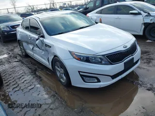 2015 Kia Optima LX with VIN KNAGM4A75F5644401, listed as a IAAI auction lot 41672679 with 217,636 mi miles. Bid and sale history available at carsss.com. Image 1.