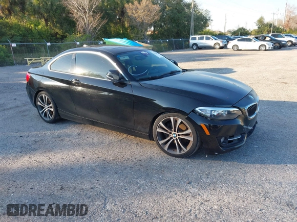 2015 BMW 2 Series 228i with VIN WBA1F5C58FV257021, listed as a IAAI auction lot 41318026 with 154,906 mi miles. Bid and sale history available at carsss.com. Image 1.