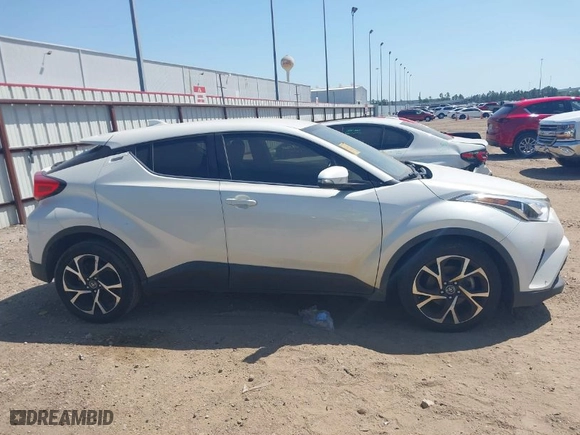 2019 Toyota C-HR XLE with VIN JTNKHMBX7K1023674, listed as a IAAI auction lot 42021152 with 106,450 mi miles. Bid and sale history available at carsss.com. Image 13.