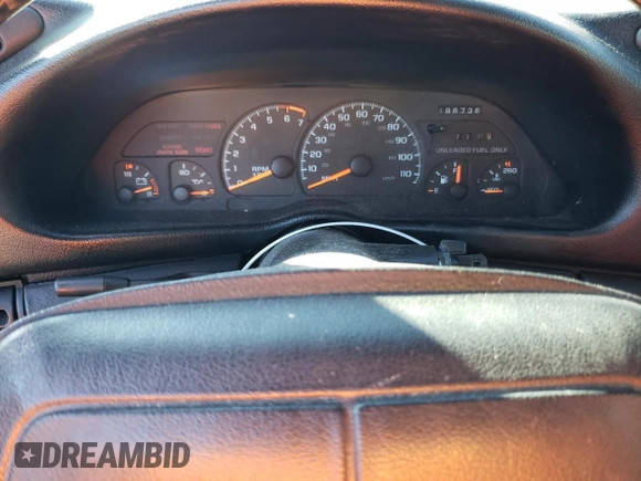 1994 Chevrolet Camaro z VIN 2G1FP22SXR2165249, wystawiony jako Copart lot #49333055 z przebiegiem 196 736 mil mil oraz Czysty tytuł • Clean title. Historia ofert i sprzedaży dostępna na DreamBid. Obrazek 9.