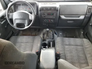 2003 Jeep Wrangler Sport z VIN 1J4FA49S93P306817, wystawiony jako Copart lot #60136385 z przebiegiem 217 208 mil mil oraz Czysty tytuł • Clean title. Historia ofert i sprzedaży dostępna na DreamBid. Obrazek 8.