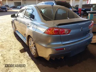 2014 Mitsubishi Lancer Evolution GSR with VIN JA32W8FV3EU008262, listed as a IAAI auction lot 41653902 with 128,977 mi miles. Bid and sale history available at carsss.com. Image 3.