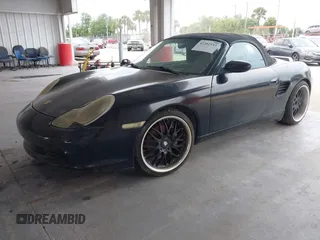2003 Porsche Boxster z VIN WP0CA29893U620342, wystawiony jako IAAI lot #42202533 z przebiegiem 141 397 mil mil oraz . Historia ofert i sprzedaży dostępna na DreamBid. Obrazek 2.
