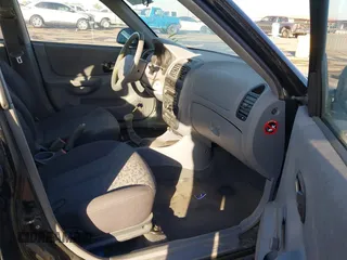 2005 Hyundai Accent GLS with VIN KMHCG45C75U632587, listed as a IAAI auction lot 40946829 with 114,666 mi miles. Bid and sale history available at carsss.com. Image 5.