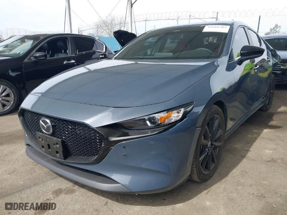 2024 Mazda Mazda3 Hatchback 2.5 S Carbon Edition with VIN JM1BPBLMXR1652534, listed as a IAAI auction lot 41681502 with 17,266 mi miles. Bid and sale history available at carsss.com. Image 2.