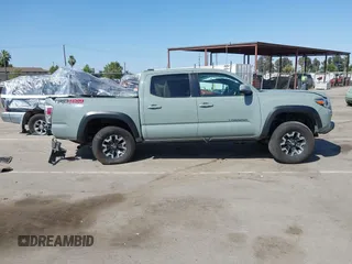 2022 Toyota Tacoma SR with VIN 3TMCZ5AN0NM489420, listed as a IAAI auction lot 42597175 with 129,340 mi miles and . Bid and sale history available at DreamBid. Image 14.